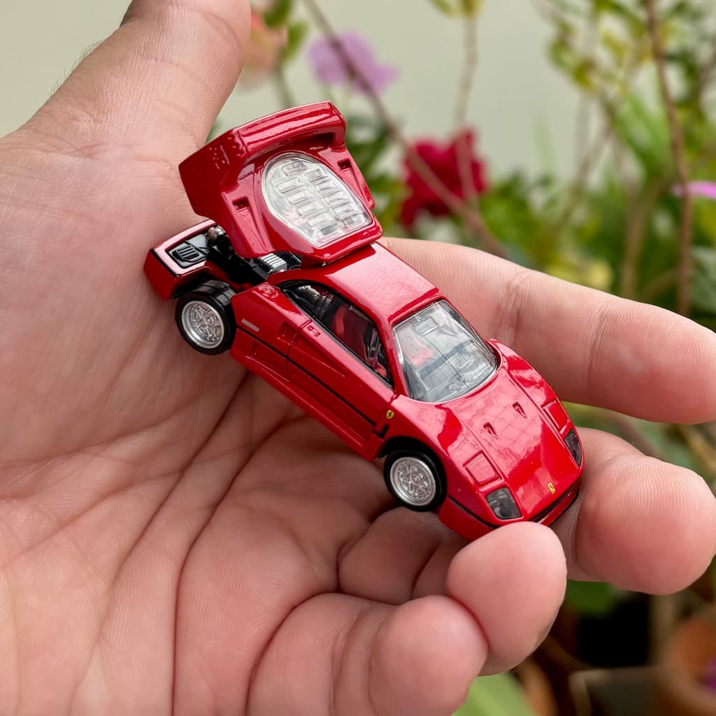 Tomica diecast Ferrari F40 held in a hand